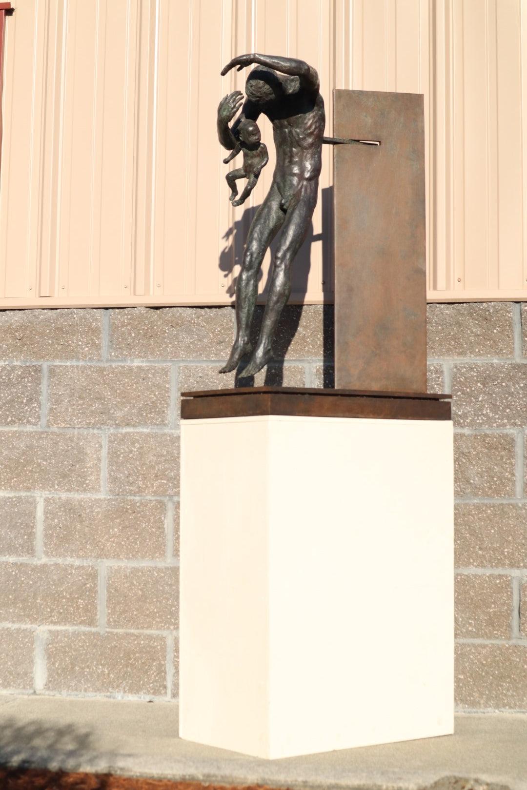 TREVOR SOUTHEY BRONZE SCULPTURE, "FATHERHOOD", DEPICTION OF MAN WITH INFANT, BRONZE AND STEEL, WITH BASE