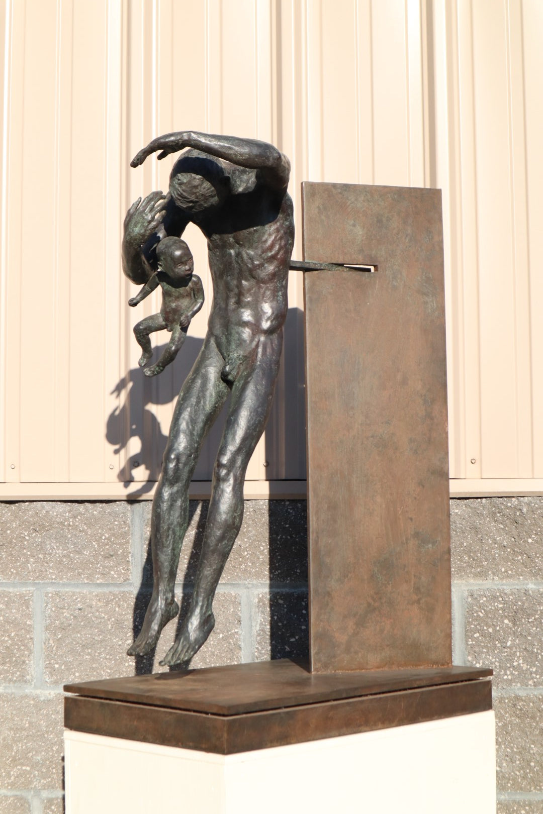 TREVOR SOUTHEY BRONZE SCULPTURE, "FATHERHOOD", DEPICTION OF MAN WITH INFANT, BRONZE AND STEEL, WITH BASE